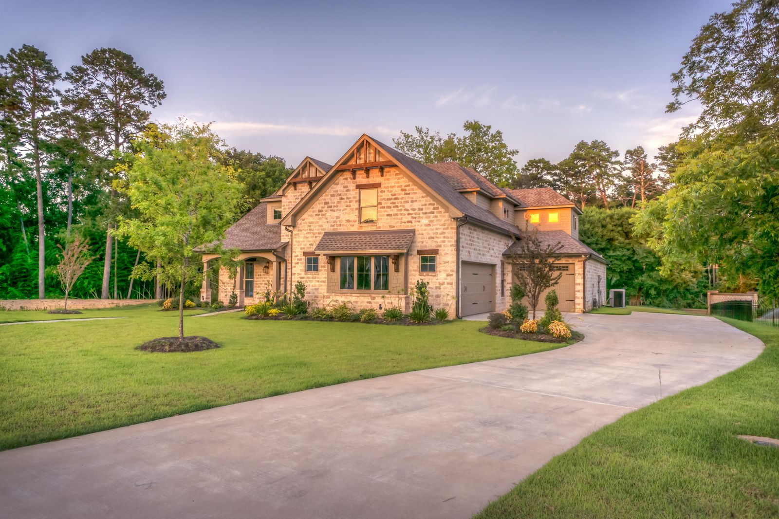 Single-family home with a green lawn, representing the homeowner experience